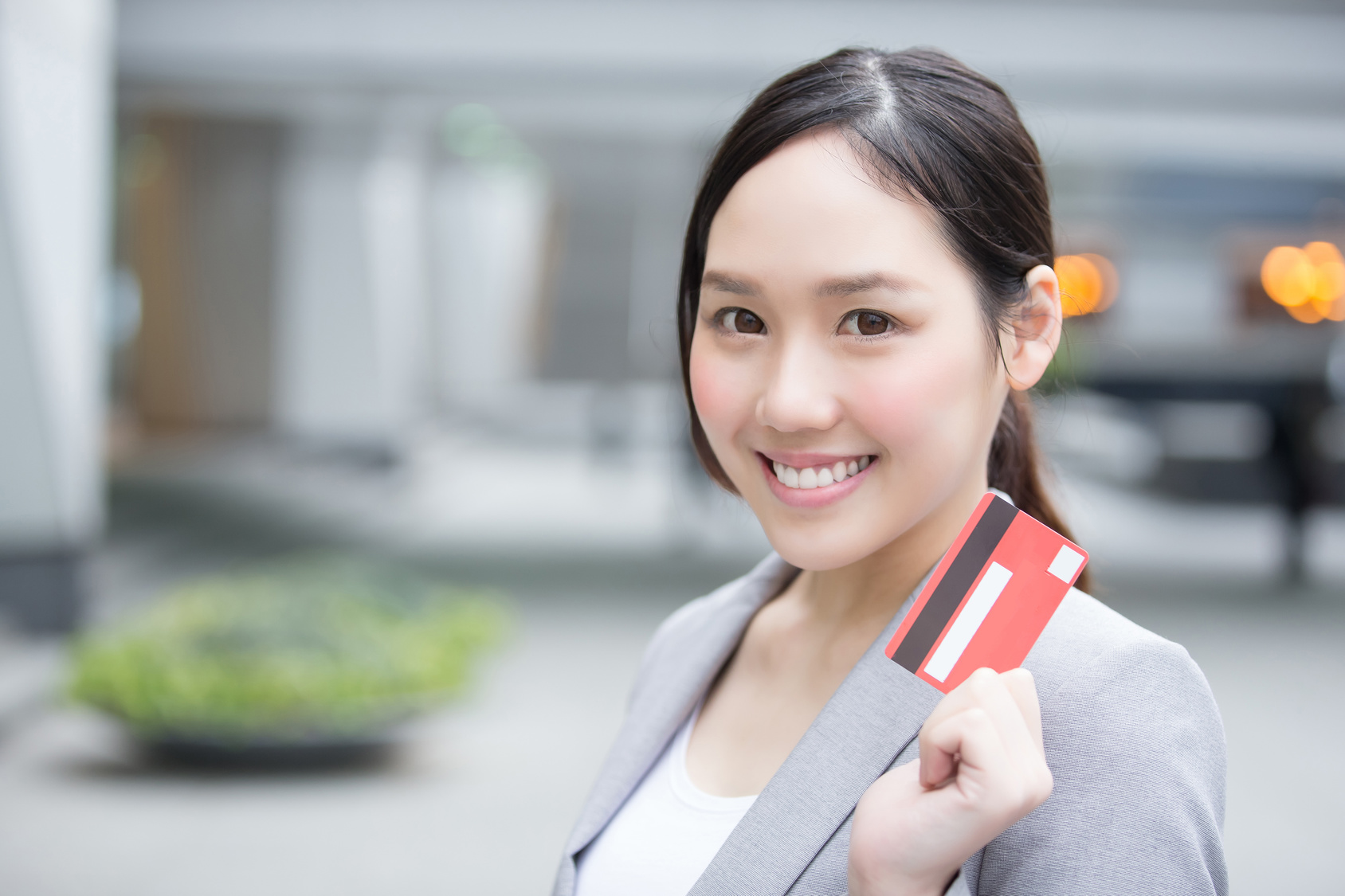 businesswoman take a credit card and go shopping in hon kong, asian