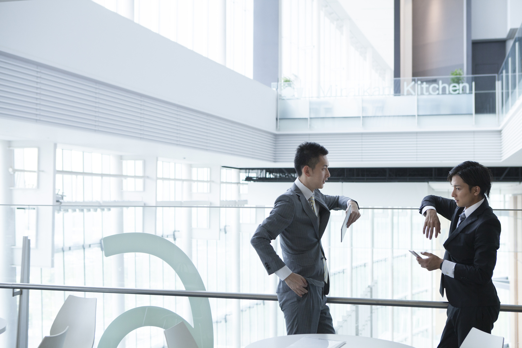 Young businessman has been the stand talking while looking at the smartphone