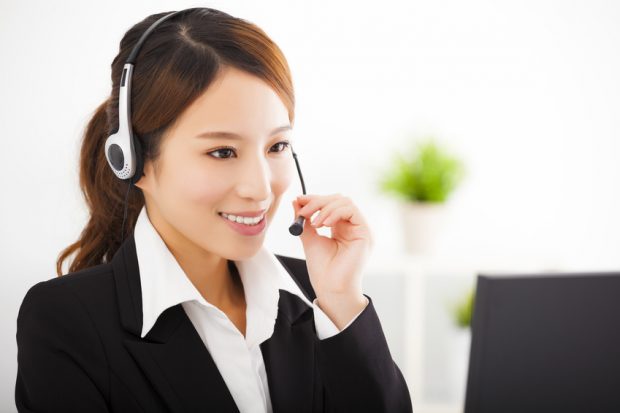 young beautiful businesswoman with headset in office