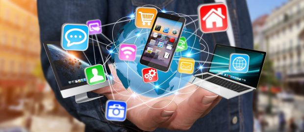 Businessman connecting tech devices